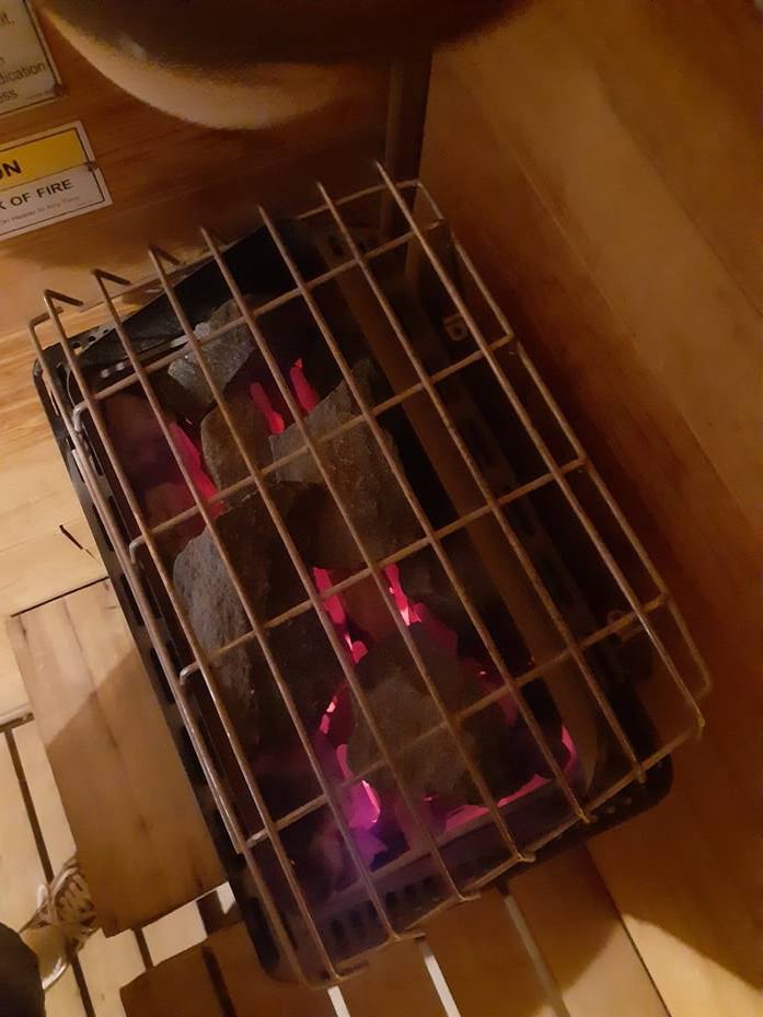 Sauna heater cleaning by skilled technician